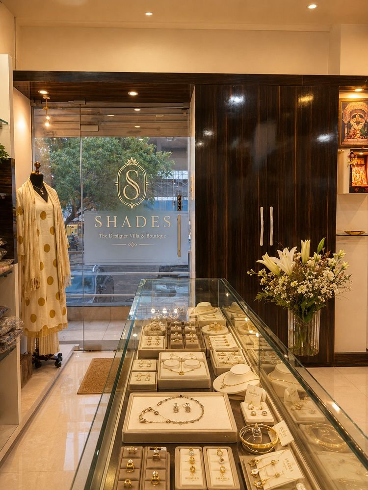 Shades entrance with the logo on the glass door and the jewellery counter